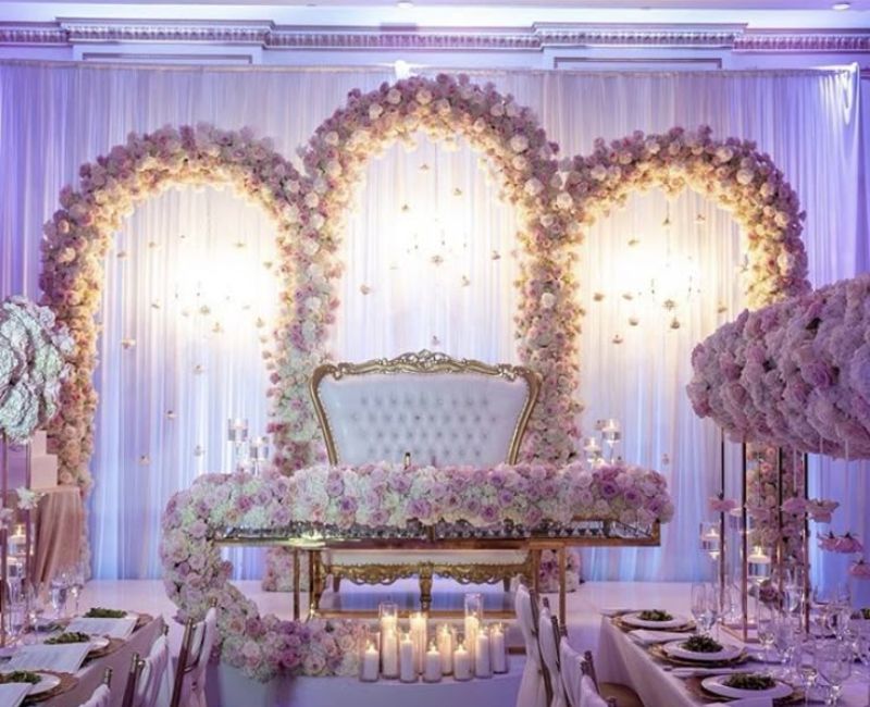 Elegant wedding setup with floral decor and romantic lighting.