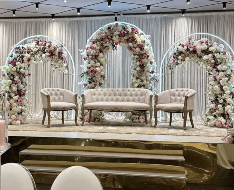 
Elegant floral arch wedding stage with luxury flower arrangements and romantic decor setup.
